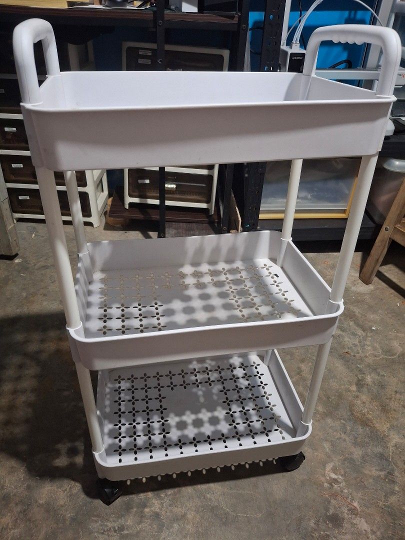 3-Tier Rolling Utility Storage Cart White (Category: Shelves, Cabinets & Racks) located in Rizal. Submitted by emskititay (Listing ID 1470381673, Image 1). Description: - Color: Clean White - 3-tier design with ventilated mesh trays for storage - Equipped with 4 smooth-rolling wheels and dual handles for easy mobility - Multi-purpose: Ideal for kitchen supplies, craft items, or bathroom toiletries - Space-saving and stylish addition to any room.