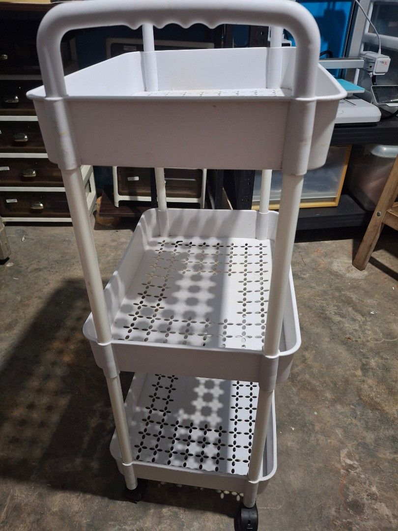 3-Tier Rolling Utility Storage Cart White (Category: Shelves, Cabinets & Racks) located in Rizal. Submitted by emskititay (Listing ID 1470381673, Image 3). Description: - Color: Clean White - 3-tier design with ventilated mesh trays for storage - Equipped with 4 smooth-rolling wheels and dual handles for easy mobility - Multi-purpose: Ideal for kitchen supplies, craft items, or bathroom toiletries - Space-saving and stylish addition to any room.