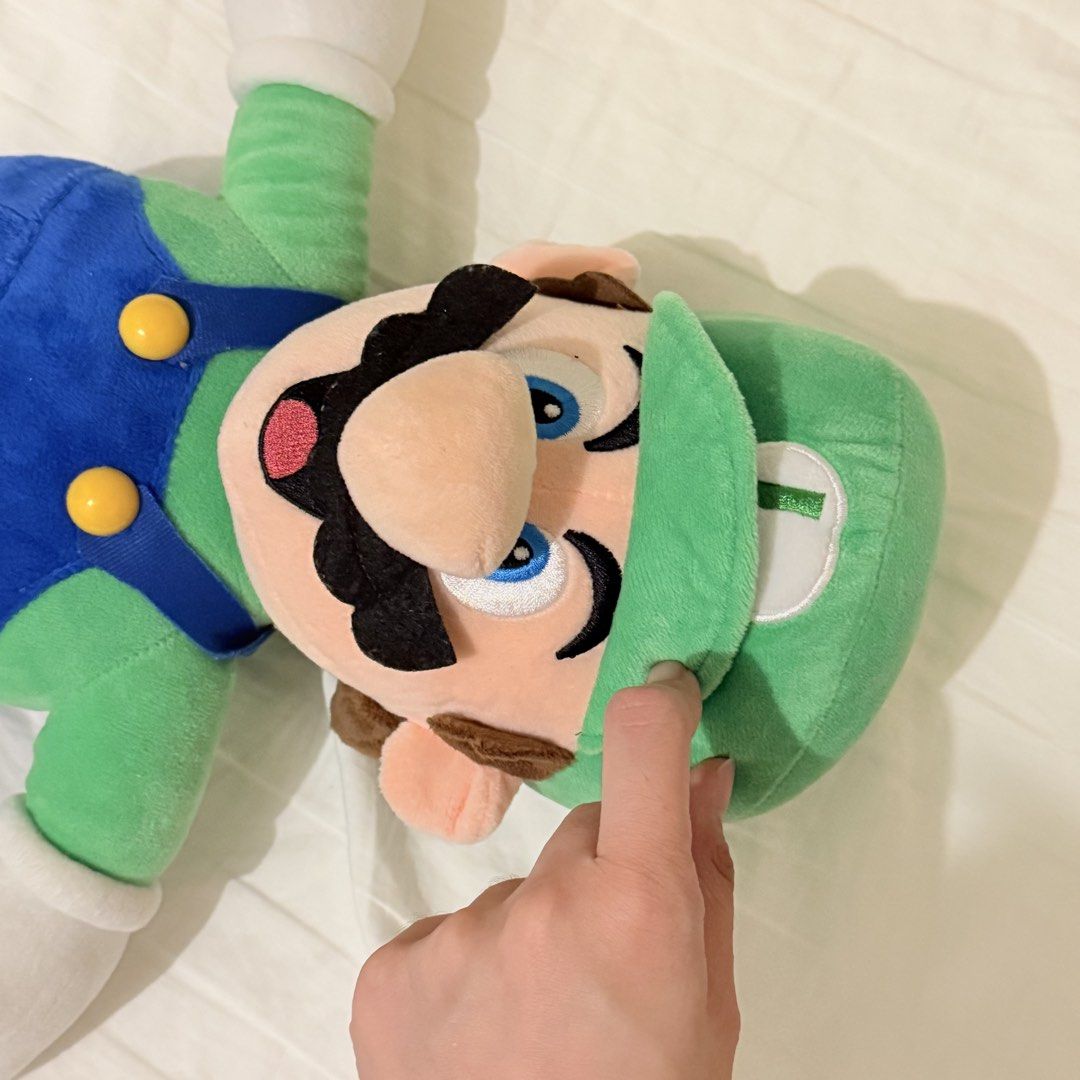 42cm Super Mario Luigi Plush Toy (Category: Plushies & Soft Toys) located in Marikina City. Submitted by lovegoeson (Listing ID 1470517118, Image 2). Description: - Large Luigi soft toy from Super Mario franchise - Features classic green hat with embroidered L emblem, blue overalls with yellow buttons, white gloves, and brown shoes - Made with soft, high-quality plush material - Clean condition with bright, vibrant colors - Great collectible or g
