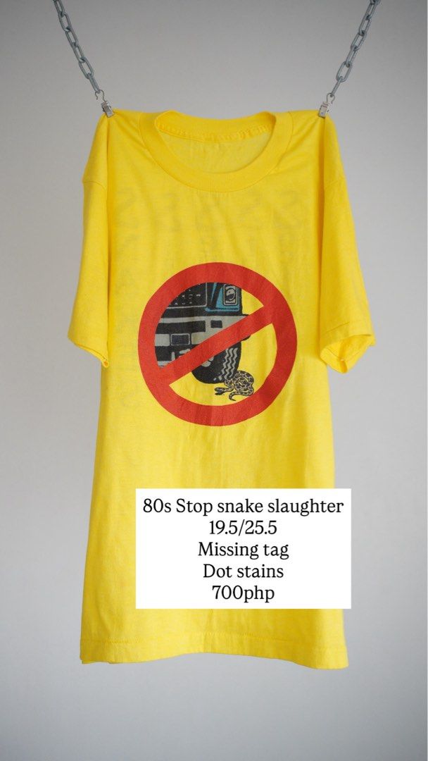 80s Stop Snake Slaughter Yellow T-Shirt (Category: Tshirts & Polo Shirts ) located in Muntinlupa City. Submitted by carl.samudio.carl.samudio56068 (Listing ID 1470480814, Image 1). Description: - Era: Authentic 80s vintage - Color: Bright yellow - Graphic: Front tire/snake no-symbol graphic with "Society to stop the senseless slaughter of snakes" vertical back text - Size: 19.5" chest x 25.5" length (Tag missing) - Condition: Has some small dot s