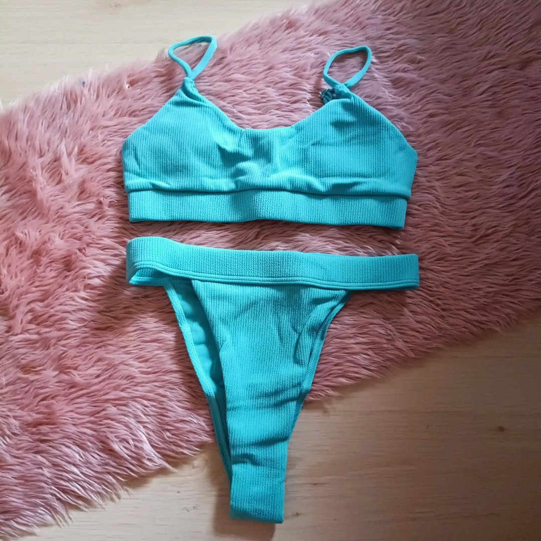 Ⓜ️ Ribbed turquoise bikini two-piece swimsuit (Category: Bikinis & Swimsuits) located in Bacoor. Submitted by Miss_Chuch0521 (Listing ID 1470363754, Image 1). Description: - Style: Two-piece swimsuit - Color: Bright turquoise - Material: Ribbed texture - Top: Scoop neck with thin adjustable straps - Bottoms: High-cut with a wide waistband - Fit: Super flattering, hugs curves nicely, true to size - Perfect for: Summer beach days and pool parties -
