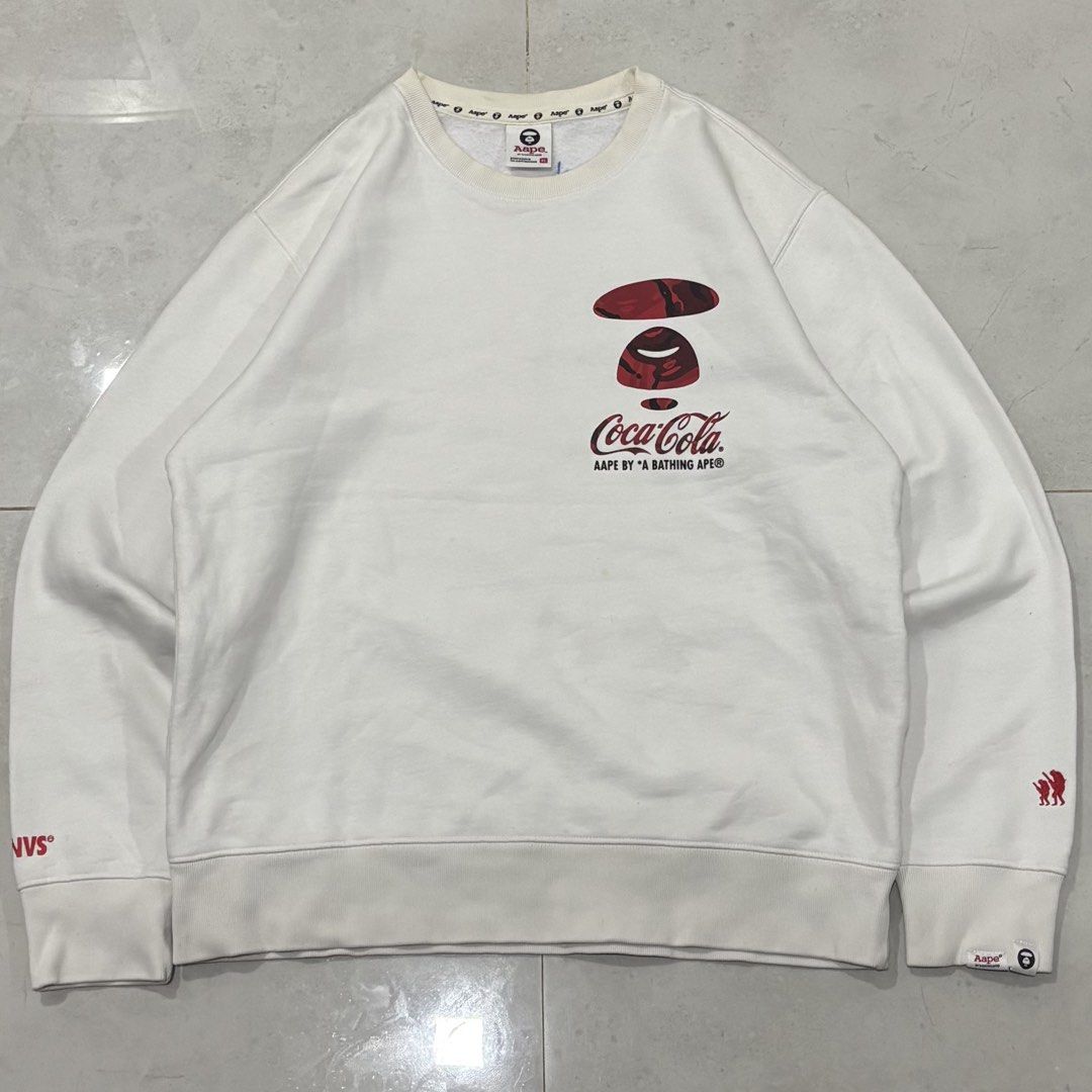 Aape x coca cola sweater (Category: Luxury Apparel) located in Cebu City. Submitted by florianmiral28 (Listing ID 1470354670, Image 1). Description: Aape x coca cola sweater Excellent condition XL W 23 L 27.