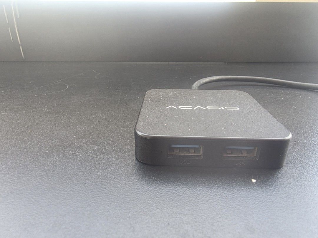 Acasis USB-C Hub Multi-Port Adapter (Category: Cables & Adaptors) located in Manila. Submitted by sound.solution (Listing ID 1470484830, Image 3). Description: - Brand: Acasis Multi-Port Adapter - Color: Sleek black finish - Connectivity: Includes USB-C cable for laptops and tablets - Ports: Multiple USB ports plus side video-out port - Design: Compact and lightweight, perfect for backpacks or desk setups - Condition: Excellent working condition 