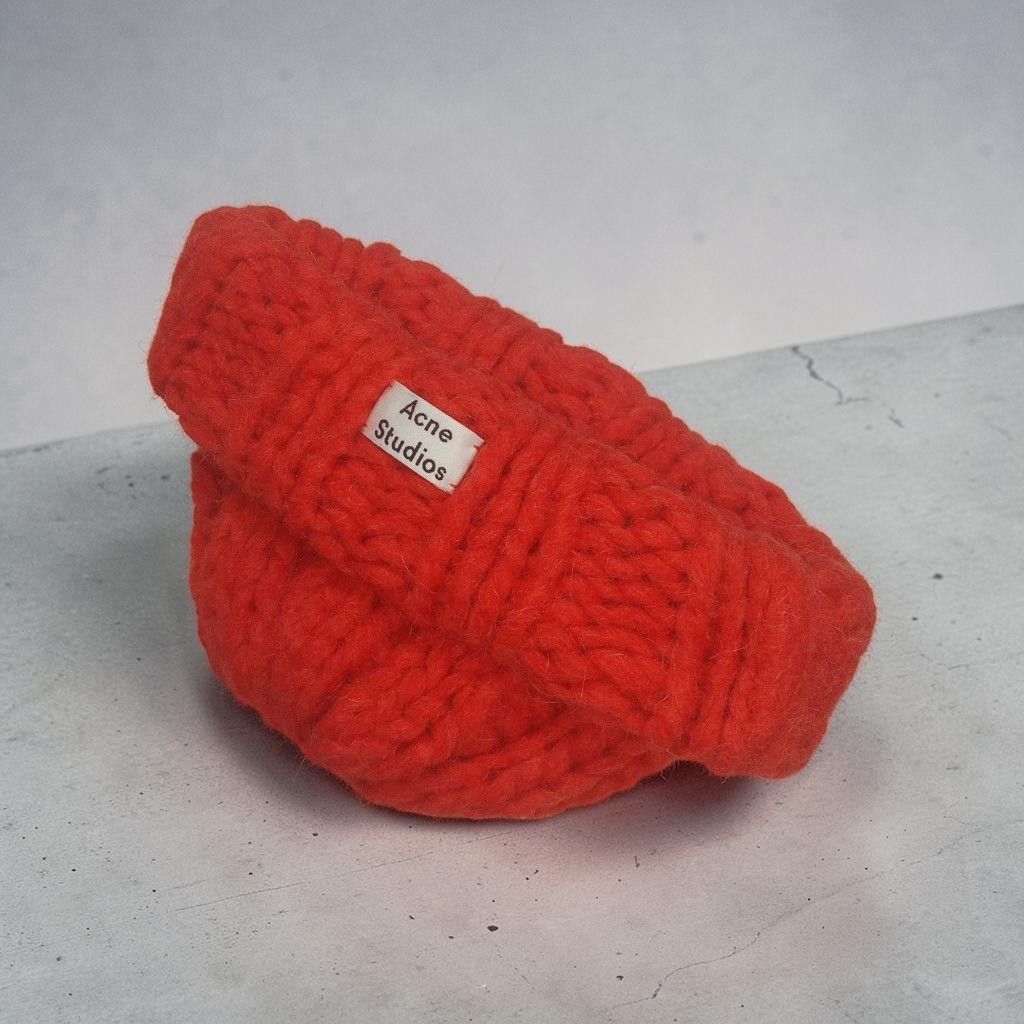 Acne Studios - Sample - Cable Knit - Wool Large Beanie (Category: Beanies) located in Manila. Submitted by grmnts_frmthe_slmz (Listing ID 1470451970, Image 2). Description: Acne Studios knit beanie in bright orange. Chunky rib knit texture, folded cuff style with brand label patch on front. Fabric tag inside indicates 70% alpaca, 16% nylon, 14% wool blend, marked as a salesman sample. Warm, soft material, thick weave. Acne Studios - Sample - Rope