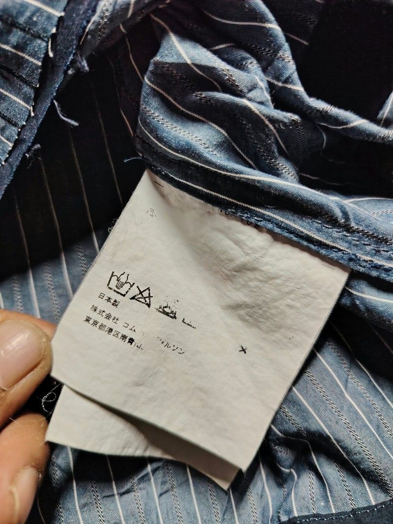 Acne Studios Striped Zip Jacket (Category: Coats, Jackets and Outerwear) located in Baguio. Submitted by tabuzomaria1422 (Listing ID 1470484551, Image 2). Description: - Brand: Acne Studios - Color/Pattern: Blue and white striped - Origin: Made in Japan - Details: High ribbed collar with dark stripes, zipper closure with leather pull tab, small embroidered chest logo, ribbed cuffs - Condition: 100% material tag visible inside, well-maintained.