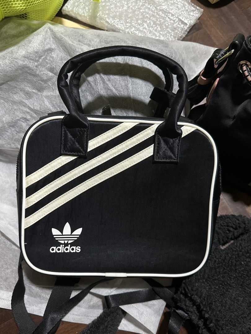 Adidas 2-way bag (Category: Cross-body Bags) located in Marikina City. Submitted by prelovedmla (Listing ID 1470451929, Image 1). Description: Like new Adidas black sling/backpack bag. Can fit up to pro max phones, wallet and small stuff. .