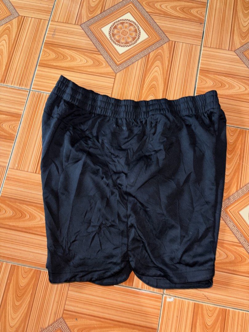 Adidas Black Athletic Shorts (Category: Shorts) located in Polomolok. Submitted by rrthrift (Listing ID 1470500647, Image 2). Description: - Color: Black - Brand: Adidas logo near the hem - Waistband: Elastic with adjustable drawstring - Fit: Regular fit, easy to pair with any tee - Material: Lightweight fabric - Best for: Workouts or casual lounging Size XL 34-40 length 17.
