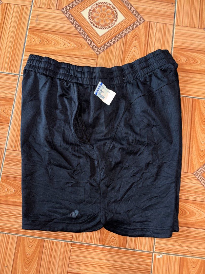 Adidas Black Athletic Shorts (Category: Shorts) located in Polomolok. Submitted by rrthrift (Listing ID 1470500647, Image 1). Description: - Color: Black - Brand: Adidas logo near the hem - Waistband: Elastic with adjustable drawstring - Fit: Regular fit, easy to pair with any tee - Material: Lightweight fabric - Best for: Workouts or casual lounging Size XL 34-40 length 17.