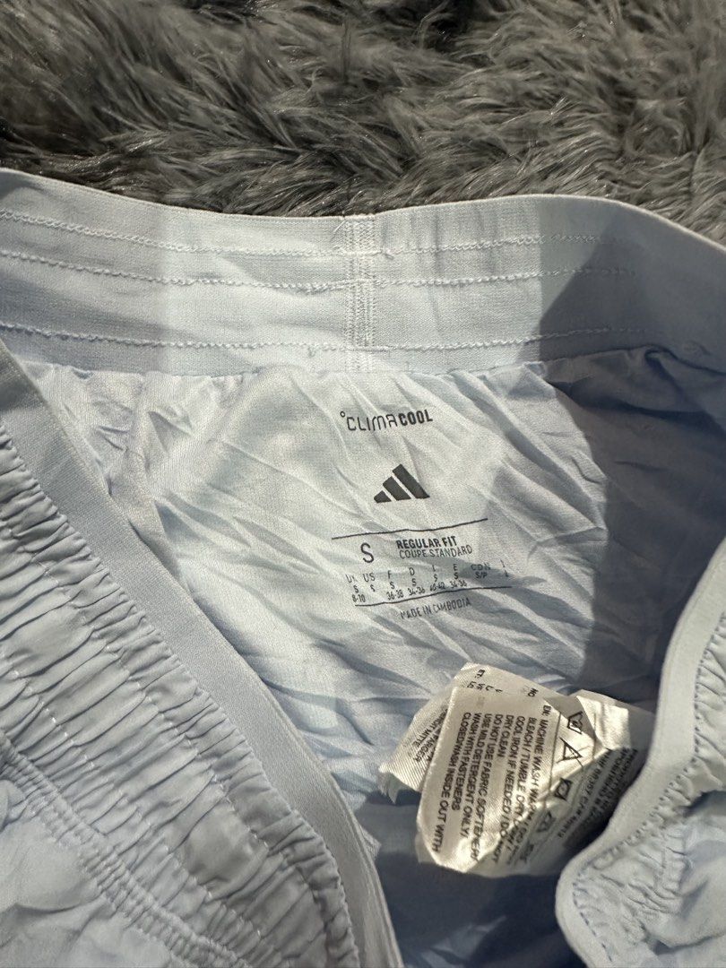Adidas Climacool Light Blue Running Shorts Size S (Category: Shorts) located in Iba. Submitted by thriftcoyan (Listing ID 1470486280, Image 3). Description: - Brand: Adidas Climacool - Color: Light Blue - Size: Small (Regular fit) - Waistband: Elastic with secure back zippered pocket - Design: Curved hem with split sides for maximum mobility - Fabric: Lightweight material, ideal for workouts and daily runs - Good as new.