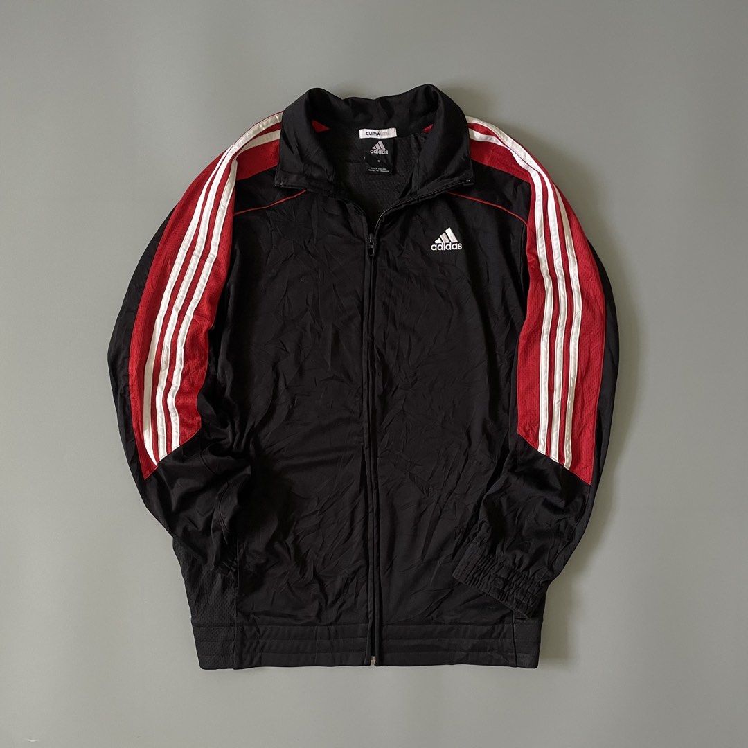 Adidas Climalite Black Red Track Jacket (Category: Coats, Jackets and Outerwear) located in Manila. Submitted by allthrift07 (Listing ID 1470400099, Image 1). Description: - Brand: Adidas - Color: Black with red and white stripe details - Size: Medium (tag inside collar) - Material/Tech: Climalite fabric for moisture management - Features: High collar, full zip closure, embroidered white Adidas logo on chest - Origin: Made in Thailand - Condition