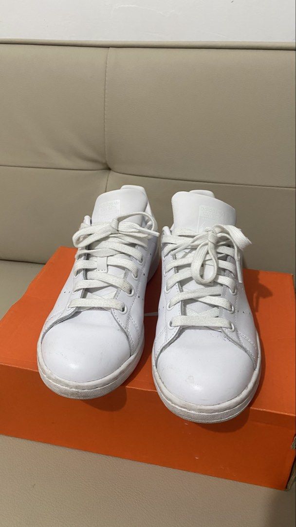 Adidas Stan Smith White Sneakers Size US 5 (Category: Sneakers) located in Makati City. Submitted by ontrend.withabi (Listing ID 1470417781, Image 1). Description: - Brand: Adidas Stan Smith - Color: Classic White - Size: US 5 / UK 4.5 / FR 37.5 (Regular Fit) - Style: Iconic low-top tennis shoe with perforated three stripes - Material: Clean leather upper with white laces - Details: Signature branding on the tongue and heel tab - No box RFS: di n