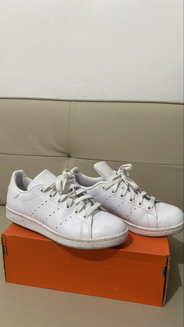 Adidas Stan Smith White Sneakers Size US 5 (Category: Sneakers) located in Makati City. Submitted by ontrend.withabi (Listing ID 1470417781, Image 2). Description: - Brand: Adidas Stan Smith - Color: Classic White - Size: US 5 / UK 4.5 / FR 37.5 (Regular Fit) - Style: Iconic low-top tennis shoe with perforated three stripes - Material: Clean leather upper with white laces - Details: Signature branding on the tongue and heel tab - No box RFS: di n