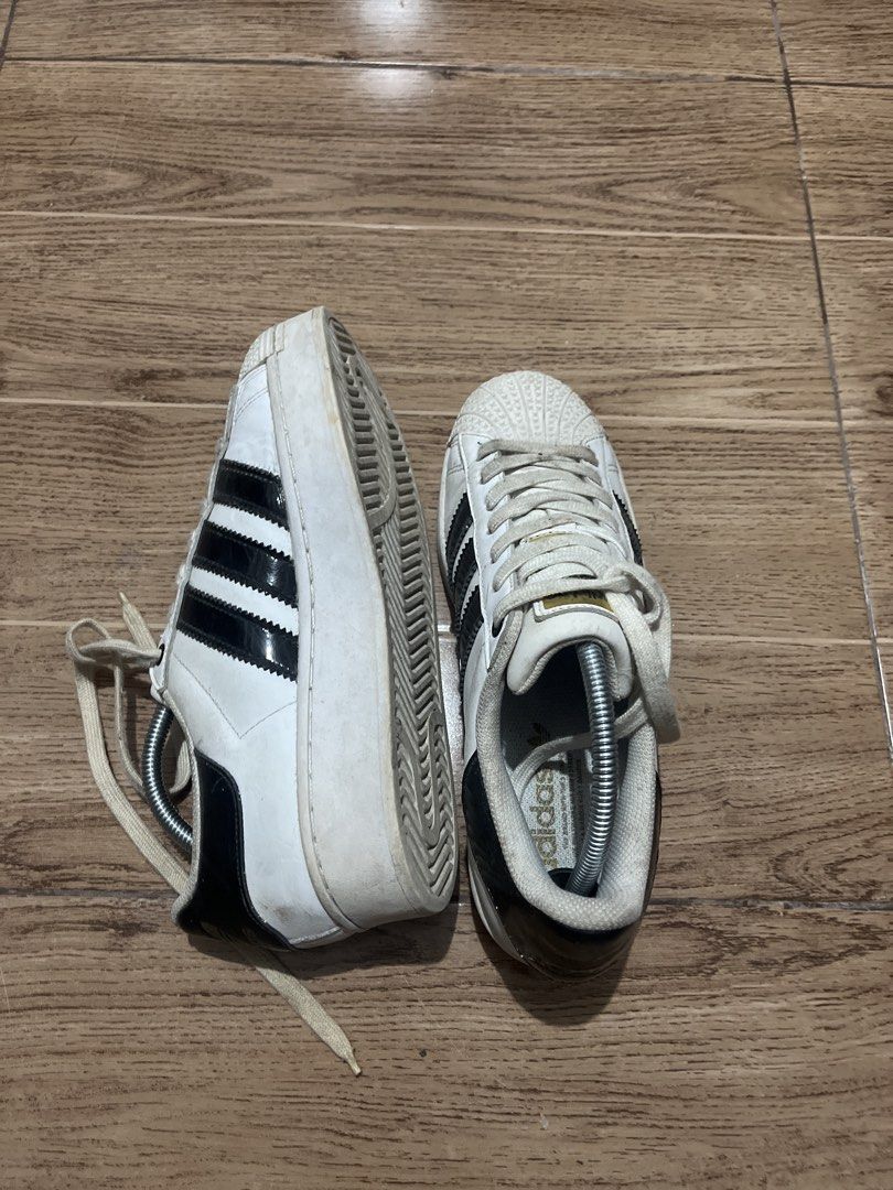 Adidas Superstar Bold Platform White Black Sneakers (Category: Sneakers) located in Tarlac. Submitted by 444_conservative (Listing ID 1470451663, Image 1). Description: - Model: Adidas Superstar Platform - Colorway: Classic White & Black with Gold branding - Design: Iconic shell toe with trendy platform sole - Condition: Minor signs of wear on midsoles and uppers from normal use - Inclusions: Laces and complimentary shoe trees to maintain shape -