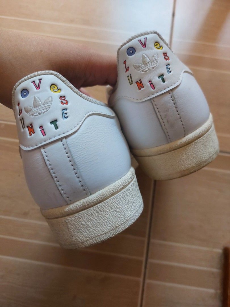 Adidas Superstar Love Unites (Category: Sneakers) located in Marikina City. Submitted by margahuela (Listing ID 1470394328, Image 3). Description: RFS: DECLUTTERING Minimal heel drags, no cracks on the leather or holes on the inner sole. Needs cleaning. Price is negotiable for sure buyer. Size: US 8 1/2, UK 8, JP 265 Shipping c/o buyer via Lalamove or J&T..