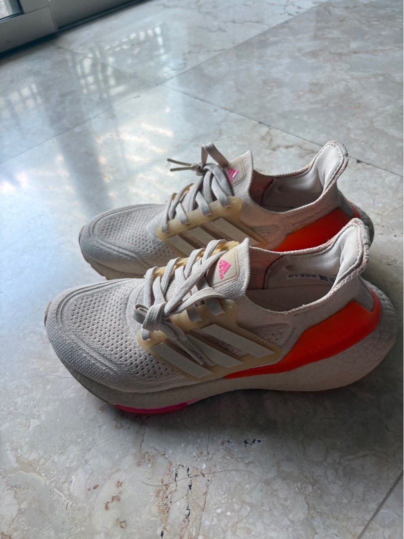 Adidas Ultraboost Womens 6.5 (Category: Sneakers) located in Manila. Submitted by bili.jn (Listing ID 1470508002, Image 2). Description: Model: Adidas Ultraboost 21 Running Shoes Colorway: Halo Ivory Ultra Pop (Beige with Orange Accents) Size: Womens US 6.5 Condition: 9/10 excellent condition.