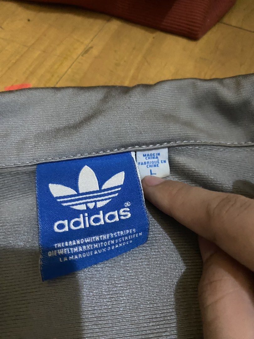 Adidas Vintage Track Jacket (Category: Coats, Jackets and Outerwear) located in Marikina City. Submitted by ctgccc (Listing ID 1470487313, Image 3). Description: Color: Gray and Red stripes Size: Large Damages: none Stains: not too seen from afar.