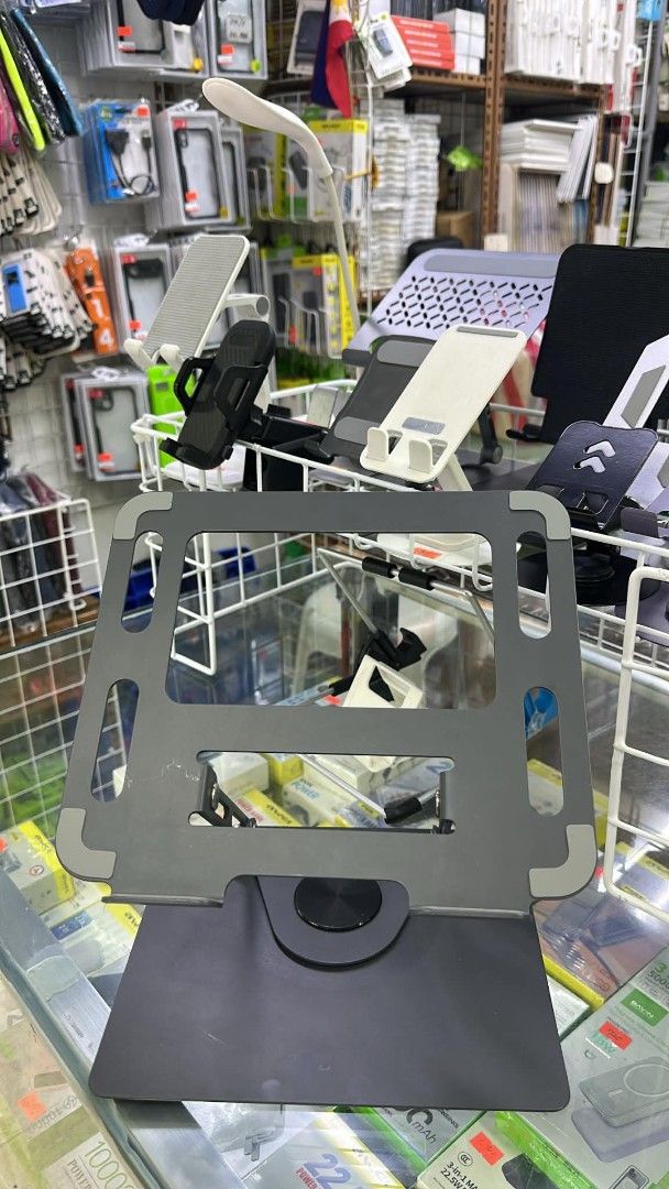 Adjustable Metal Laptop Stand with 360 Rotating Base (Category: Laptops & Notebooks) located in Manila. Submitted by ericklee23 (Listing ID 1470361732, Image 1). Description: - Color: Grey - Material: Sturdy metal build - 360° Rotating base for easy screen sharing - Fully adjustable height and angle for ergonomic comfort - Hollow design promotes airflow and laptop cooling - Ideal for WFH setups, online classes, and saving desk space.