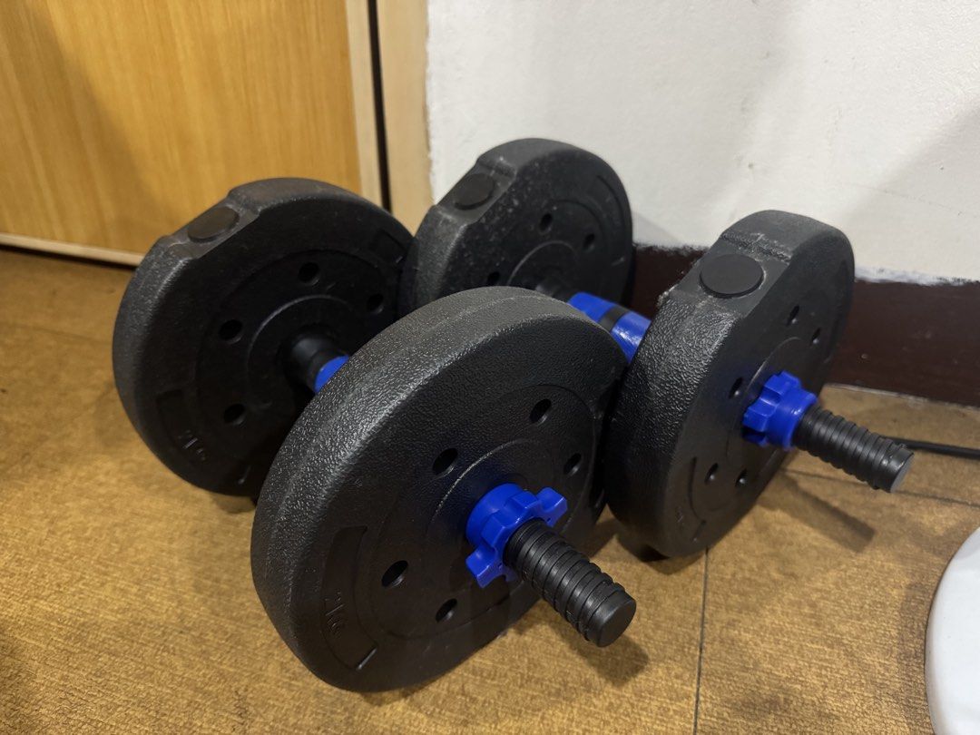 Adjustable Weight Dumbbell Set with Spinlock Collars (Category: Weights & Dumbbells) located in Pasig City. Submitted by rodzrox (Listing ID 1470510492, Image 1). Description: - Pair of adjustable dumbbells with durable black plates - Secure blue spinlock collars for quick weight changes - Textured handles ensure a firm and safe grip - Compact design ideal for home fitness routines - Clearly visible weight markings on plates.