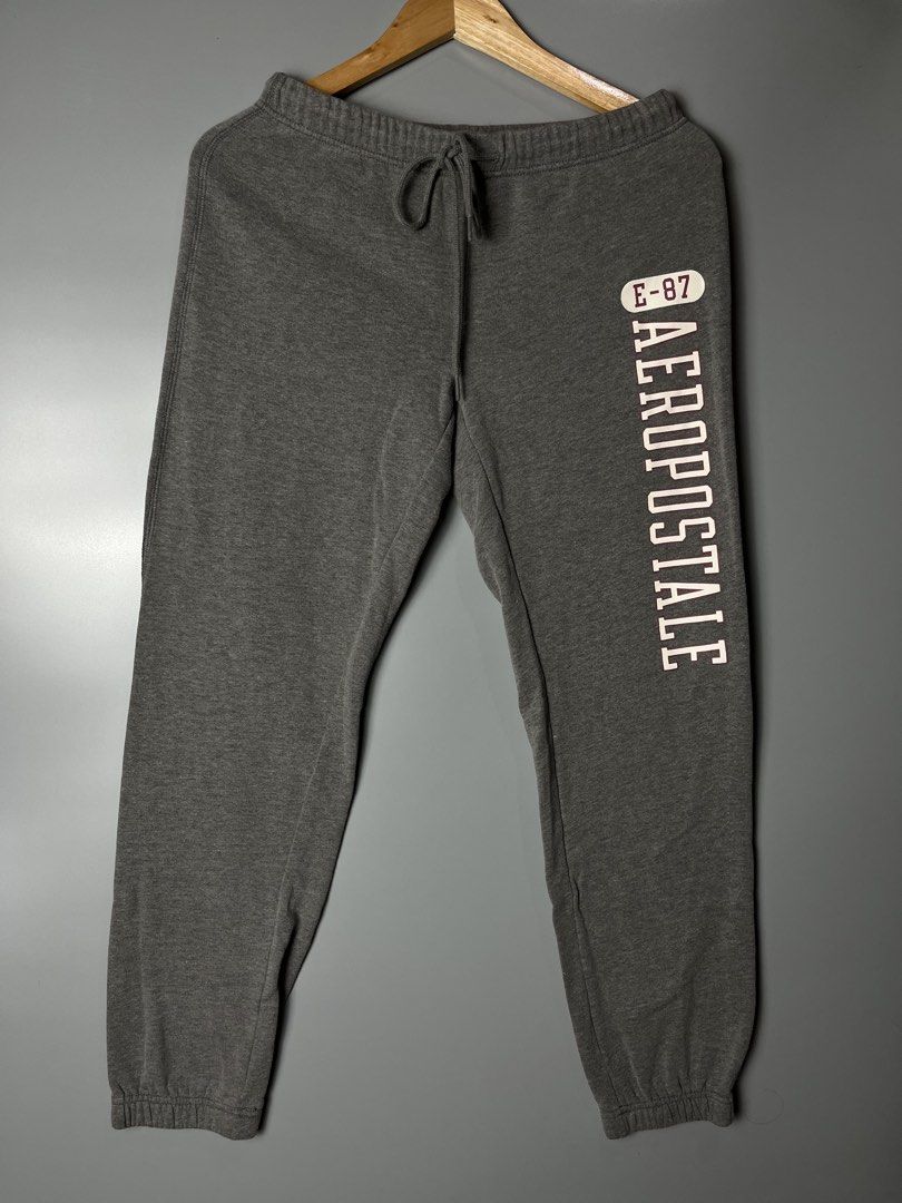Aeropostale Grey Sweatpants Size M (Category: Joggers) located in Dagupan City. Submitted by loves2thrifth (Listing ID 1470422206, Image 1). Description: - Brand: Aeropostale - Size: Medium (Style 2985) - Color: Grey with white and burgundy logo lettering - Material: Cotton and polyester blend (very soft and warm) - Features: Drawstring waistband and ribbed ankle cuffs - L 35 inches - W 14 inches .