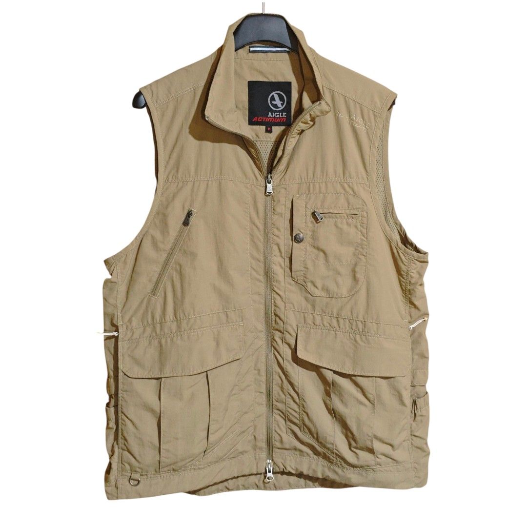 AIGLE Actimum Vintage Technical Utility Vest (Category: Coats, Jackets and Outerwear) located in Quezon City. Submitted by oldturnedtogold (Listing ID 1470349448, Image 1). Description: AIGLE Actimum Vintage Technical Utility Vest Size Medium Beige/Khaki Shoulder Width - 16" Body length - 26" Chest Width - 22" Details: - Authentic Aigle Actimum vintage outdoor line - nylon fabric - lightweight and quick-dry - LOTSSS OF POCKETSSSS (front pockets h
