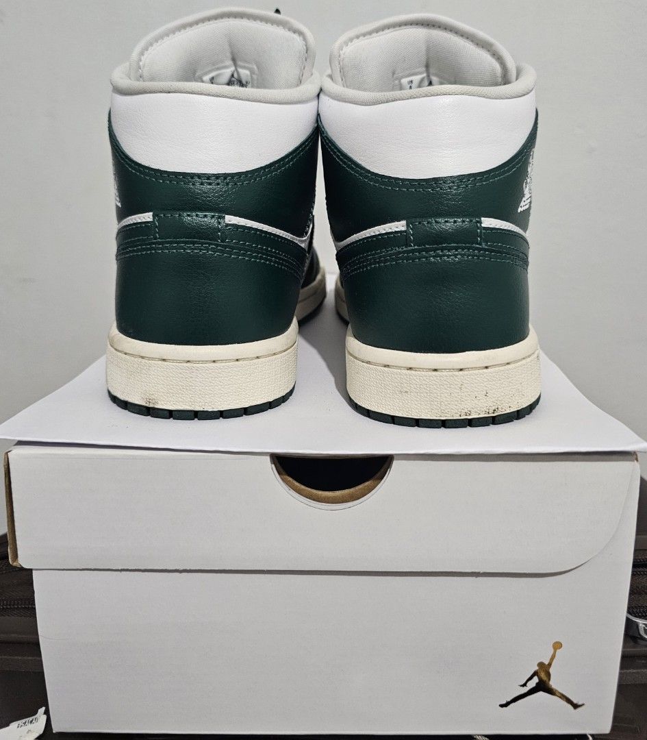 Air Jordan 1 Mid Oxidized Green (Category: Sneakers) located in Paranaque City. Submitted by chigon (Listing ID 1470536431, Image 3). Description: - Model: Women's Air Jordan 1 Mid - Colorway: White and Oxidized Green - Size: US 8 / UK 5.5 / EUR 39 - Includes: Original box with matching style code (BQ6472 133) - Design: Classic high-top silhouette, white leather base, dark green overlays and laces - Condition: Brand new-ish, minor dirt on midsole