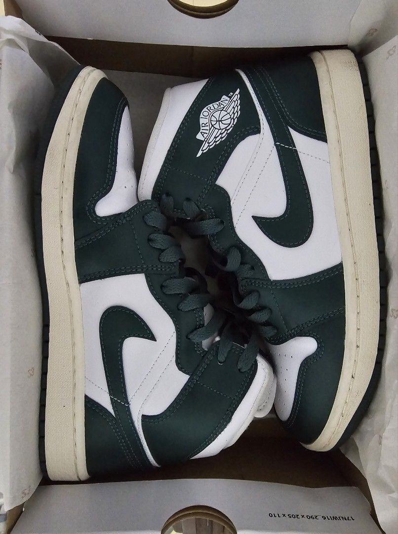 Air Jordan 1 Mid Oxidized Green (Category: Sneakers) located in Paranaque City. Submitted by chigon (Listing ID 1470536431, Image 2). Description: - Model: Women's Air Jordan 1 Mid - Colorway: White and Oxidized Green - Size: US 8 / UK 5.5 / EUR 39 - Includes: Original box with matching style code (BQ6472 133) - Design: Classic high-top silhouette, white leather base, dark green overlays and laces - Condition: Brand new-ish, minor dirt on midsole