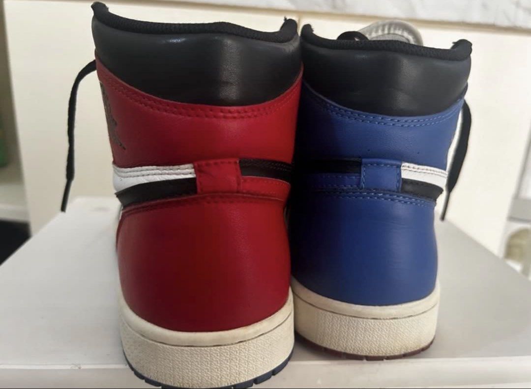 Air Jordan 1 Retro High Top 3 (Category: Sneakers) located in Taguig. Submitted by allgoodsph (Listing ID 1470471038, Image 3). Description: - Model: Air Jordan 1 High Mismatched (Red & Blue Toe) - Colorway: Black, White, Red, and Blue - Material: Classic leather upper with rubber cupsole - Inclusions: Comes with black laces - Condition: Normal creasing on toe boxes and minor scuffs on midsoles from wear - Authenticity: 100% authentic, message fo