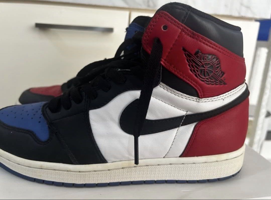 Air Jordan 1 Retro High Top 3 (Category: Sneakers) located in Taguig. Submitted by allgoodsph (Listing ID 1470471038, Image 2). Description: - Model: Air Jordan 1 High Mismatched (Red & Blue Toe) - Colorway: Black, White, Red, and Blue - Material: Classic leather upper with rubber cupsole - Inclusions: Comes with black laces - Condition: Normal creasing on toe boxes and minor scuffs on midsoles from wear - Authenticity: 100% authentic, message fo