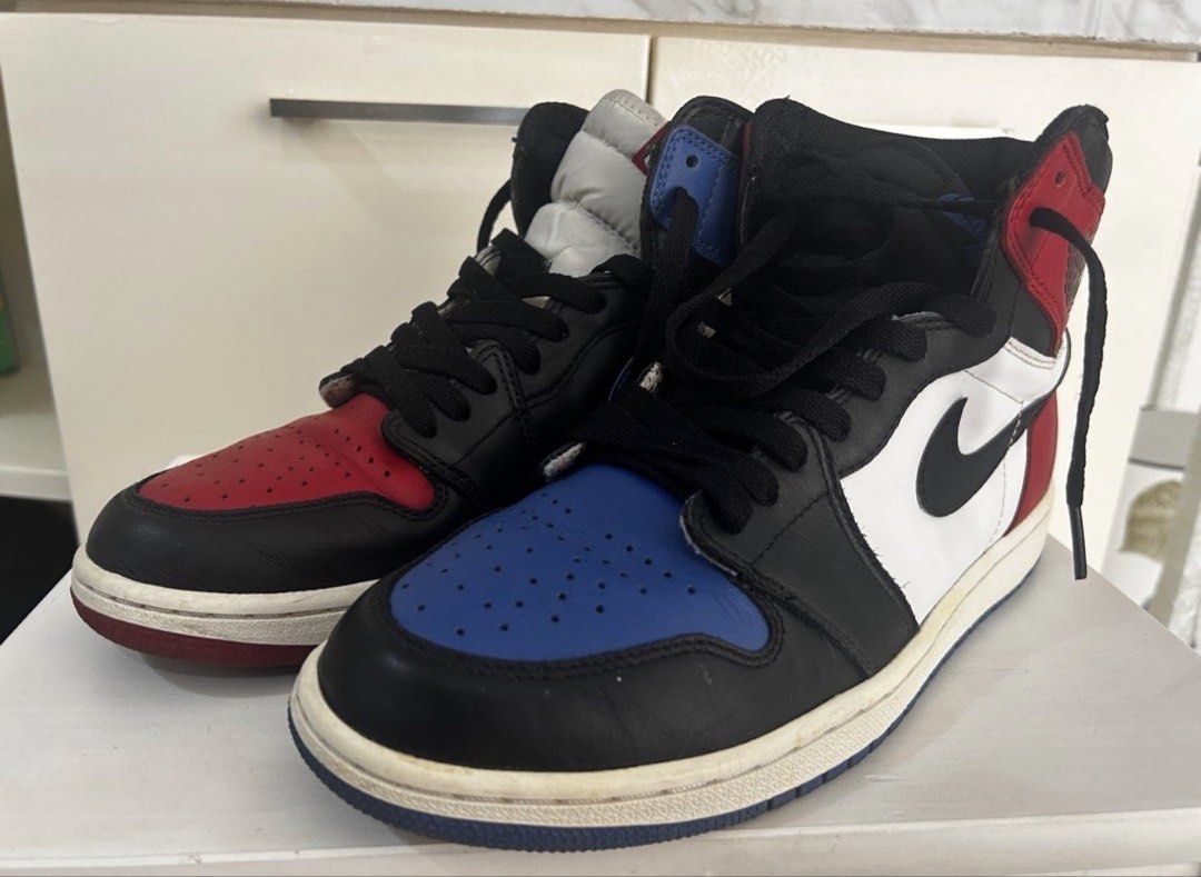 Air Jordan 1 Retro High Top 3 (Category: Sneakers) located in Taguig. Submitted by allgoodsph (Listing ID 1470471038, Image 1). Description: - Model: Air Jordan 1 High Mismatched (Red & Blue Toe) - Colorway: Black, White, Red, and Blue - Material: Classic leather upper with rubber cupsole - Inclusions: Comes with black laces - Condition: Normal creasing on toe boxes and minor scuffs on midsoles from wear - Authenticity: 100% authentic, message fo