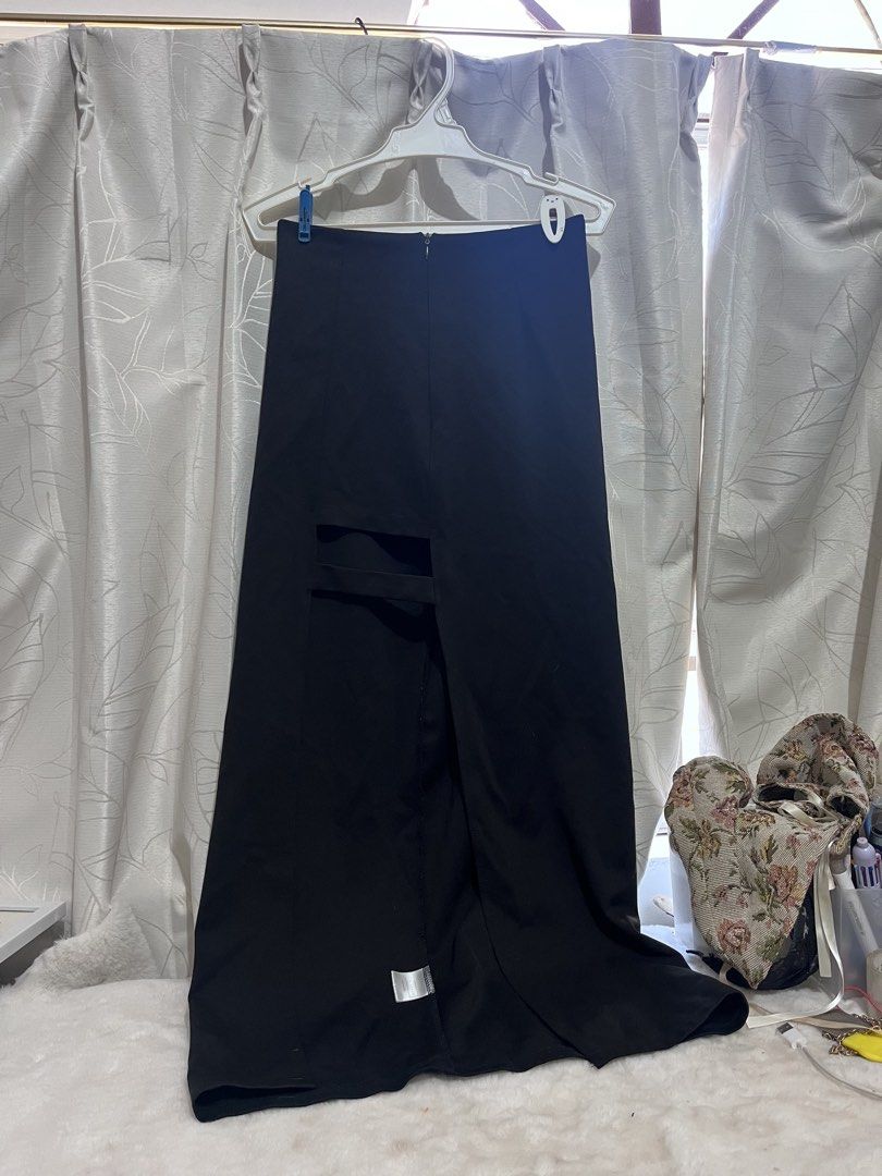 Air Space Black Midi Skirt Size M (Category: Skirts) located in Manila. Submitted by clandistine (Listing ID 1470355503, Image 1). Description: - Brand: Air Space - Size: M - Color: Black - Condition: Worn once, excellent shape - Details: High waist, back zipper closure, unique strap cutout near the front slit .