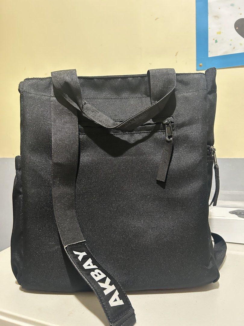 Akbay Black Bag (Category: Backpacks) located in Caloocan City. Submitted by g4bbygabby (Listing ID 1470487989, Image 1). Description: - Brand: Akbay - Color: Classic Black - Material: Durable heavy-duty canvas - Straps: Dual top carry handles & adjustable clip-on shoulder straps - Pockets: Front zippered pocket with fabric pull tab + internal divider and side pockets - Ideal for: Everyday use, school, or work -Tutuklap lang ng unti yung bakal na