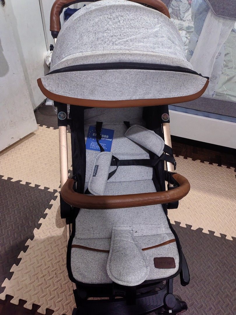 Akeva Baby Stroller Grey with Brown Leather Handle (Category: Strollers) located in Quezon City. Submitted by cjzelaq (Listing ID 1470537908, Image 3). Description: - Brand: Akeva Baby Stroller Halos d anung nagamit kasi ayaw ni baby, labahan nyo nlng, may mga konting dumi sa pag kaka stock Like new. - Color/Design: Stylish grey tweed fabric with brown leather-look handle and bumper bar - Frame: Lightweight with elegant gold-tone accents - Safety