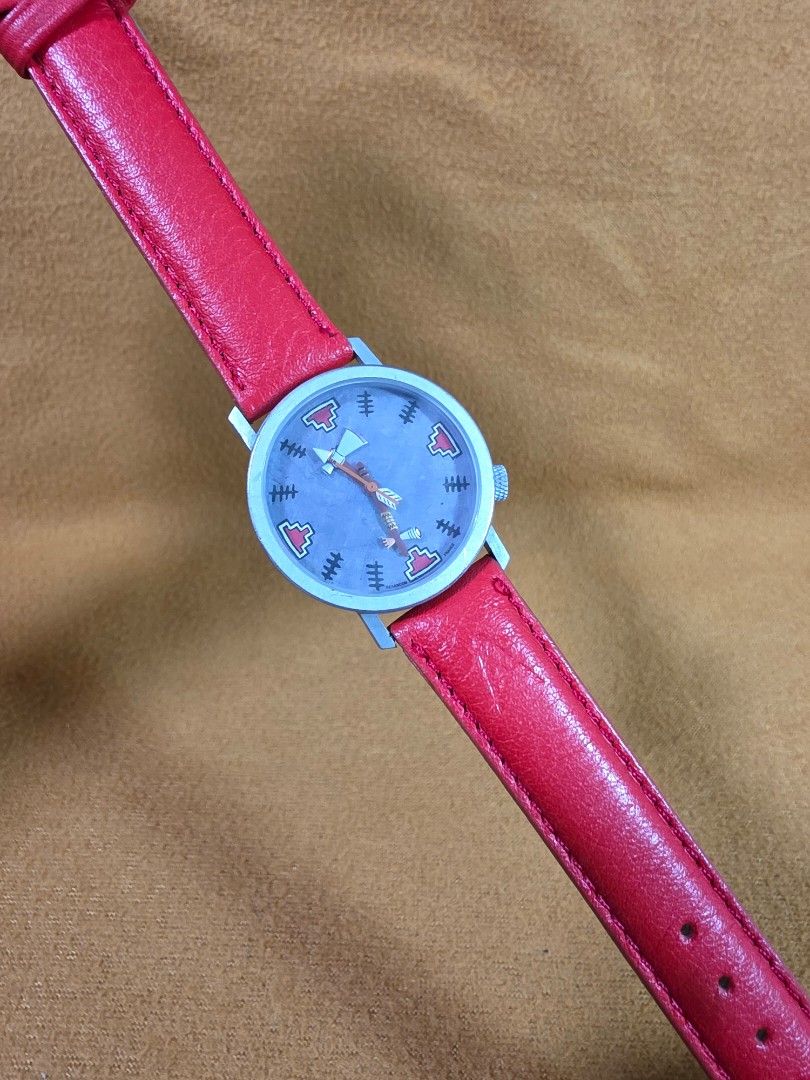 AKTEO J.C. Mareschal Native American Theme Watch (Category: Women's Watches) located in Rosales. Submitted by akumie30 (Listing ID 1470519029, Image 2). Description: - Brand: AKTEO (Designed by J.C. Mareschal) - Theme: Native American inspired dial with unique arrow and tomahawk hands - Case: Stainless steel, made in France - Water Resistance: 30 meters - Strap: Bright red leather with silver crown - Condition: Excellent, highly collectible timep