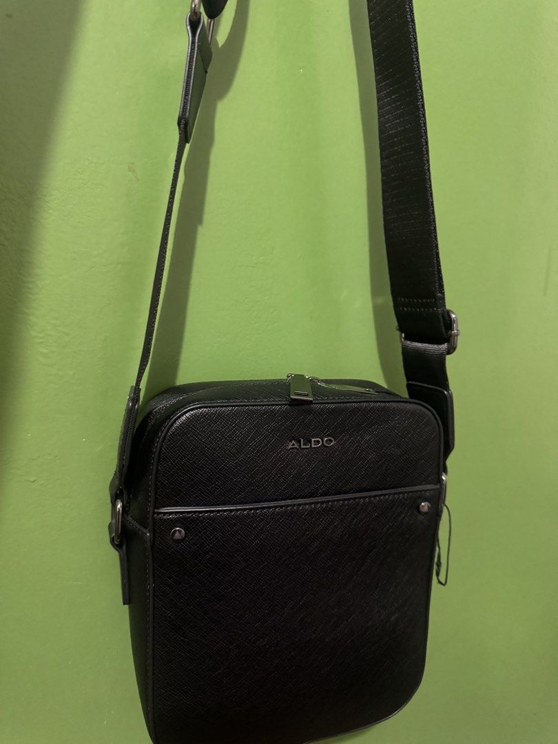 ALDO Black Crossbody Bag (Category: Cross-body Bags) located in Quezon City. Submitted by jojo_0402 (Listing ID 1470506215, Image 2). Description: Selling my Aldo Unisex Sling Bag. Like new and well maintained. No flaws or issues. Original, purchased in the US.