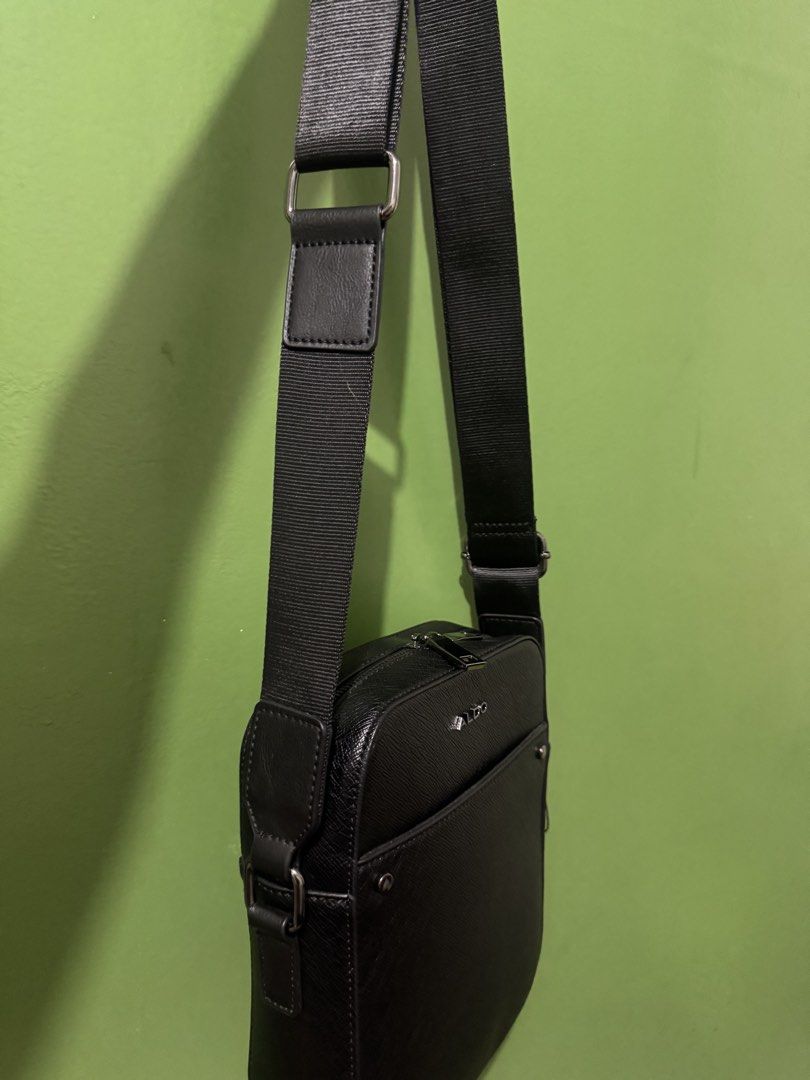ALDO Black Crossbody Bag (Category: Cross-body Bags) located in Quezon City. Submitted by jojo_0402 (Listing ID 1470506215, Image 3). Description: Selling my Aldo Unisex Sling Bag. Like new and well maintained. No flaws or issues. Original, purchased in the US.