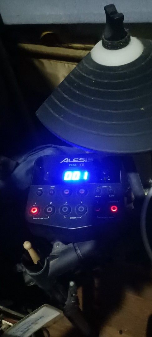 Alesis DM Lite Electronic Drum Kit (Category: Musical Instruments) located in Taguig. Submitted by grandfish_55ab5c (Listing ID 1470517229, Image 2). Description: - Brand/Model: Alesis DM Lite Electronic Drum Set - Inclusions: Sound module, black drum pads, cymbal pads, and sturdy metal frame rack - Features: Blue backlit sound module with digital display and easy control buttons - Condition: Good working condition - Perfect for: Quiet home pract