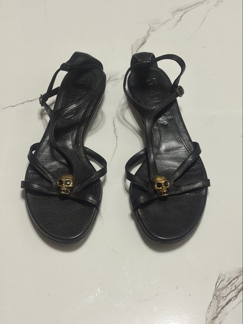 Alexander McQueen Black Leather Skull Flat Sandals (Category: Sneakers & Footwear) located in Balanga. Submitted by momstyle.ph (Listing ID 1470504008, Image 1). Description: Black leather flat sandals by Alexander McQueen. Signature gold tone skull hardware on the front straps. Adjustable ankle strap with buckle closure. Made in Italy. Size 37 SALE PRICE💕.