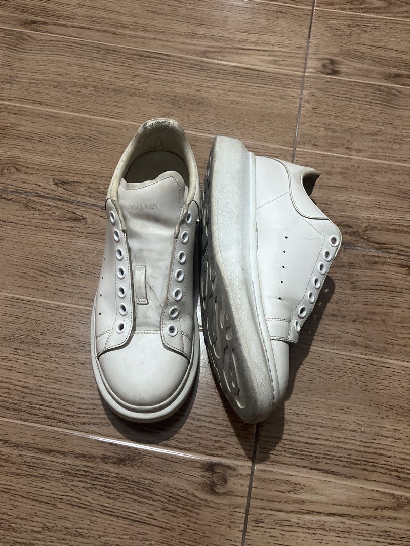 Alexander McQueen Oversized Sneakers White (Category: Sneakers) located in Tarlac. Submitted by 444_conservative (Listing ID 1470452086, Image 1). Description: - Brand: Alexander McQueen - Color: Classic White - Style: Chunky rubber sole leather sneakers - Condition: Pre-loved, selling as-is - Flaws: Missing laces, visible dirt marks, and overall wear on leather and soles - Note: Perfect for restoration or casual everyday beaters.