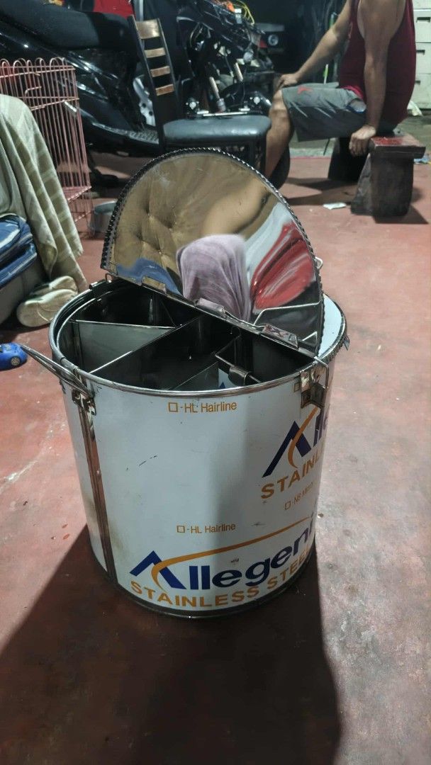 Allegeni Stainless Steel Compartment Container Drum (Category: Food Organization & Storage) located in Manila. Submitted by wisegem-231b (Listing ID 1470400364, Image 2). Description: - Brand: Allegeni - Material: Heavy-duty stainless steel - Design: Industrial food prep style with divided internal compartments - Features: Secure locking lid mechanism and sturdy side handles - Condition: Brand new with protective plastic film still attached to ex