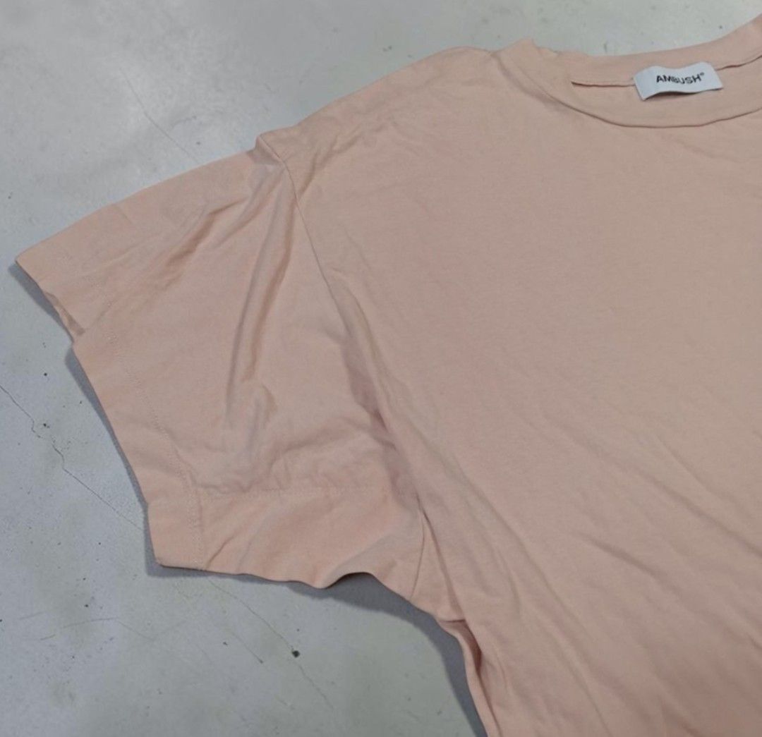 Ambush - Minimal Chest Script Logo - Layered Oversized Tshirt (Category: Shirts) located in Manila. Submitted by grmnts_frmthe_slmz (Listing ID 1470402563, Image 3). Description: AMBUSH short sleeve t-shirt in pale pink. Green logo printed on the upper chest. Crew neck collar with white branded neck tag. Relaxed drop-shoulder fit. Soft cotton fabric, clean finish. Straight hemline with subtle side detail. Ambush - Minimal Chest Script Logo - Laye