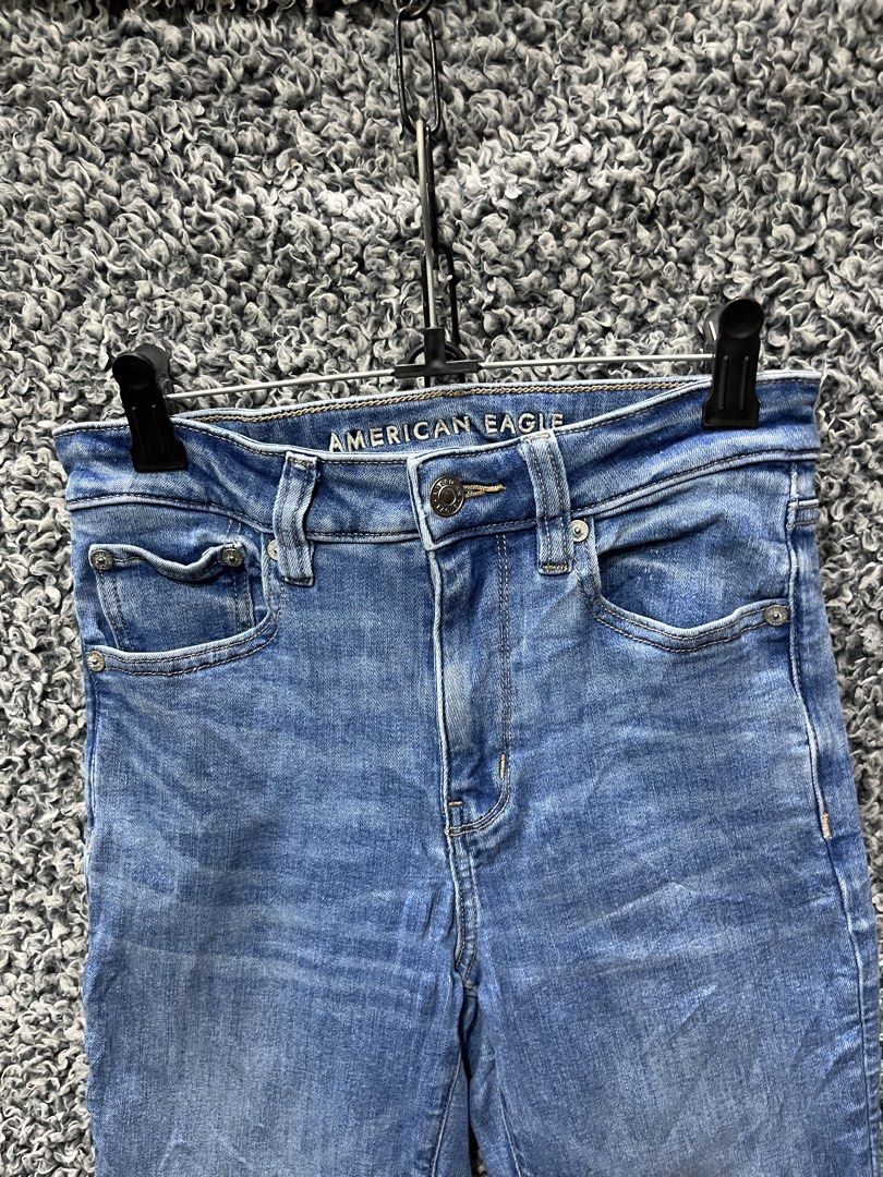 American Eagle High-Waisted Flare Jeans | Size 2 (Category: Jeans) located in General Trias. Submitted by zrchustle.604 (Listing ID 1470462486, Image 3). Description: American Eagle High-Waisted Flare Jeans in a classic medium wash with light whiskering across the front pockets. This retro-inspired style features a body-hugging fit through the hips and thighs before opening up into a prominent flared hem at the bottom..
