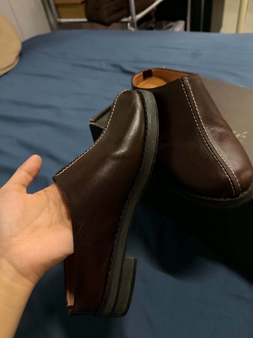 Andanté Brown Leather Mules (Category: Flats & Sandals) located in Davao. Submitted by gelomgbn (Listing ID 1470461273, Image 2). Description: - Brand: Andanté - Item: Brown leather mules with slip-on design - Details: Chic white contrast stitching down the center - Comfort: Low heel and cushioned insoles for everyday wear - Packaging: Original shoe box included - Condition: Good, with minor surface scuffs on the leather side from normal handling