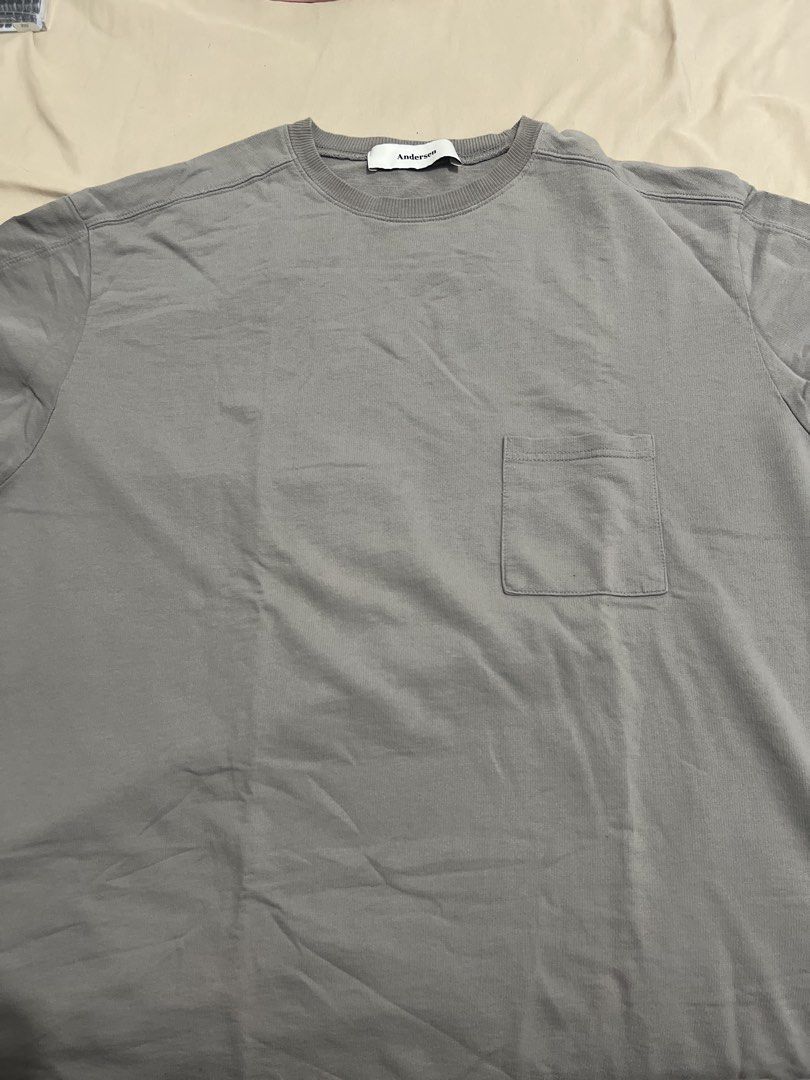 Andersen Grey Pocket T-Shirt (Category: Tshirts & Polo Shirts ) located in Manila. Submitted by luckyearth-28cb (Listing ID 1470507966, Image 1). Description: - Length: 29inches Width: 24inches - Brand: Andersen - Color: Solid grey - Material: Comfortable, breathable cotton - Design: Classic crew neck with a single chest pocket on the right side - Fit: Relaxed fit through the torso and short sleeves - Styling: Neutral tone that easily pairs with 