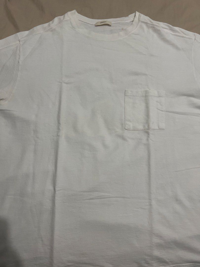 Andersen White Pocket T-Shirt (Category: Tshirts & Polo Shirts ) located in Manila. Submitted by luckyearth-28cb (Listing ID 1470507943, Image 1). Description: - Length: 29inches Width: 24inches - Brand: Andersen - Color: Plain white - Style: Crew neck, short sleeves, relaxed fit - Details: Left chest pocket, ribbed collar, tag intact - Look: Clean, minimal, and easy to match with daily outfits.