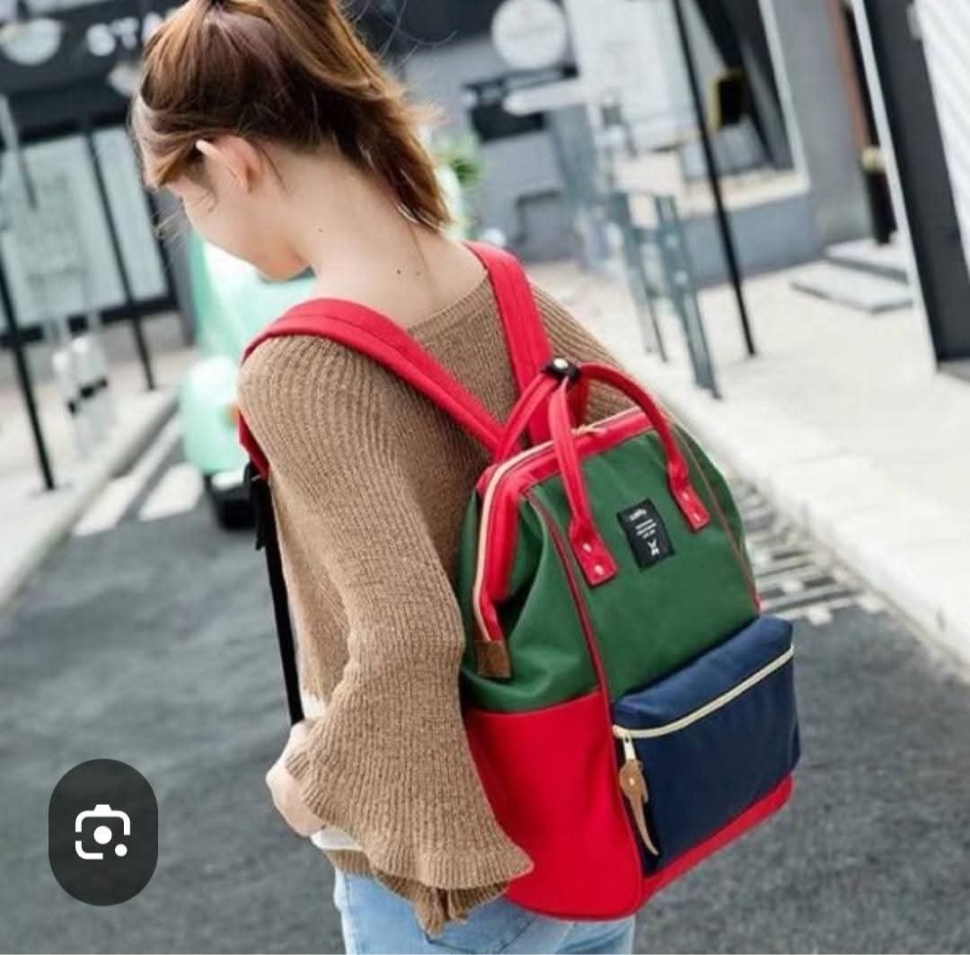Anello Multicolored Canvas Backpack Green Red Blue (Category: Backpacks) located in Baliuag. Submitted by marieannfernando23 (Listing ID 1470370026, Image 3). Description: - Brand: Anello - Material: Durable Canvas - Colorway: Green body, red trim and handles, dark blue front pocket - Features: Signature wide rectangular frame opening, spacious main compartment with zipper closure - Pockets: Front zip pocket and convenient side pockets - Straps: 