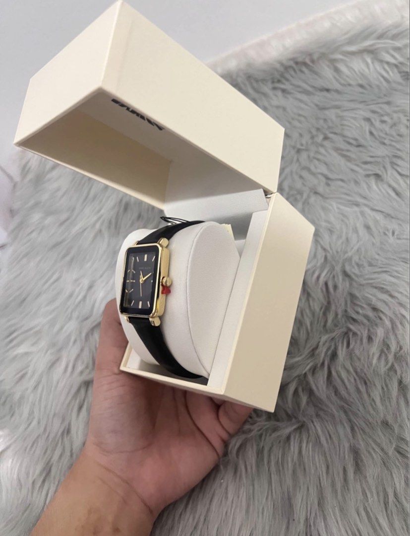 Anne Klein Rectangular Watch Black Gold (Category: Women's Watches) located in Manila. Submitted by allysamaligaya28 (Listing ID 1470512921, Image 3). Description: - Brand: Anne Klein - Condition: Brand new, never used, clean condition - Design: Rectangular gold-tone case with a sleek black dial - Markers & Hands: Elegant gold-tone - Strap: Slim black leather strap - Inclusions: Complete with original cream-colored presentation box and cushion - 