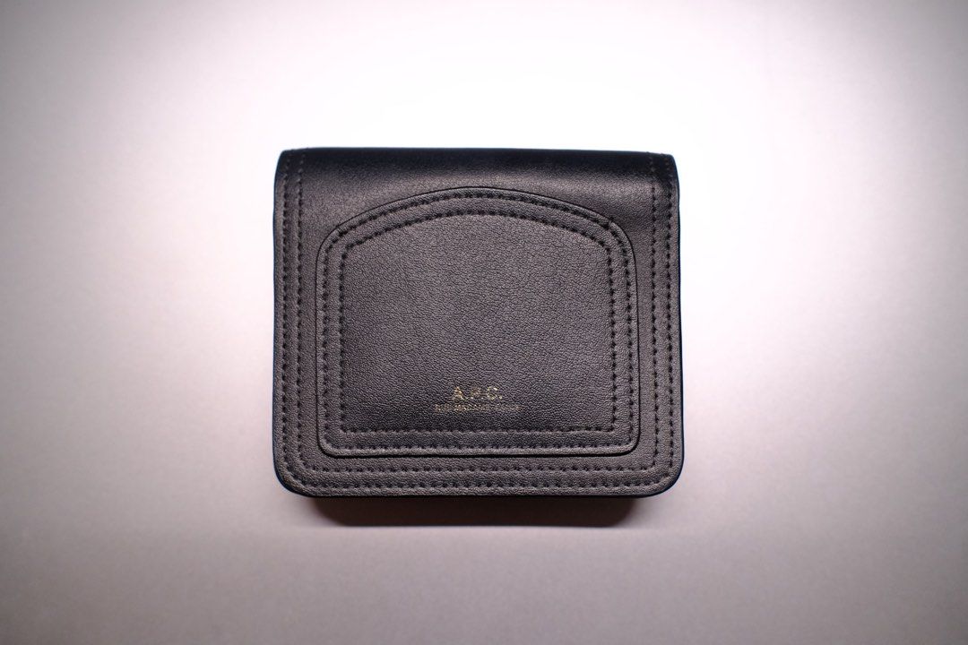 A.P.C. Japan Louisette Compact Wallet (Noir) (Category: Wallets & Card Holders) located in Marikina City. Submitted by buyitfromian (Listing ID 1470458971, Image 3). Description: Negotiable! - Brand: A.P.C. - Purchased from Second Street Shibuya - RFS: decluttering - Material: Smooth black leather with clean stitching - Hardware: Gold logo stamp on front (Faded) - Closure: Secure snap button - Interior: Card slots and zippered coin pocket.