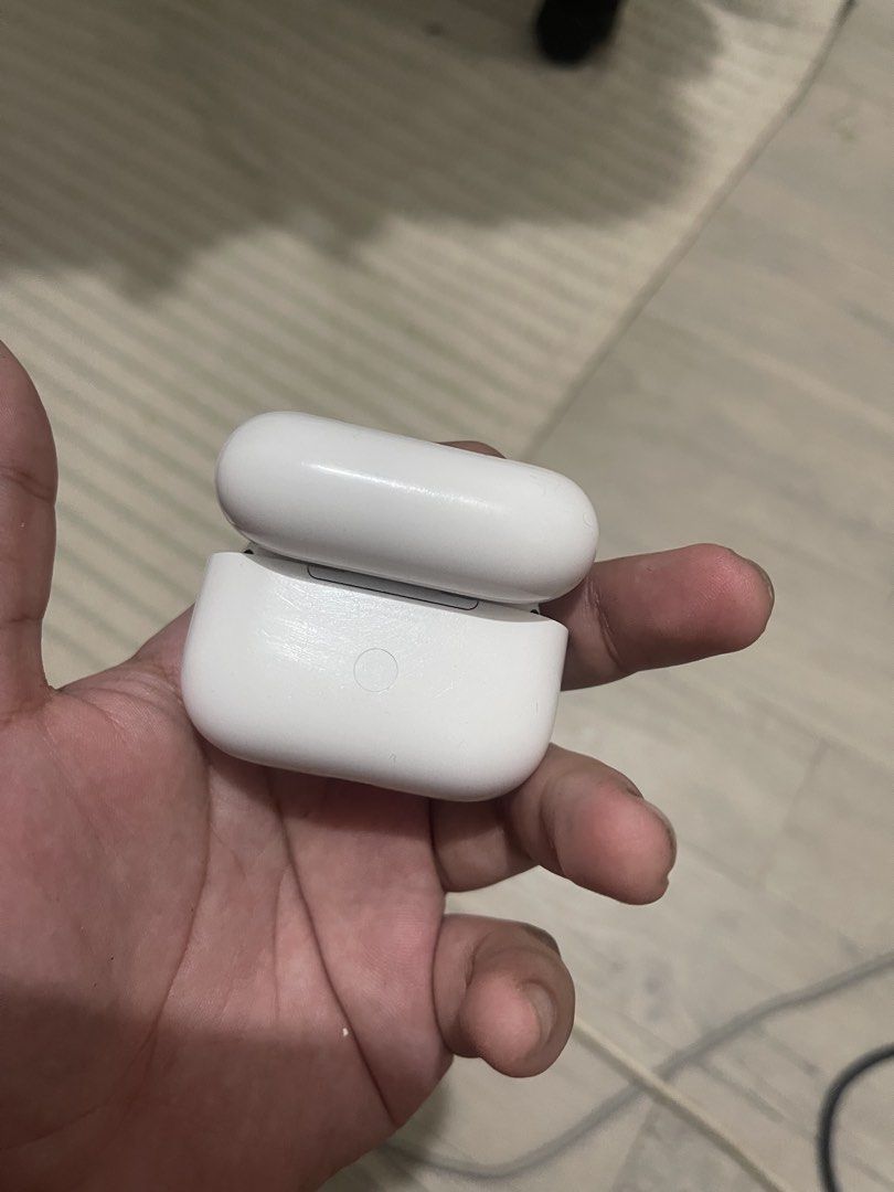 Apple AirPods Pro 2 type c charging case (with box and extra buds) (Category: Earphones) located in Manila. Submitted by keruuben (Listing ID 1470464875, Image 2). Description: - Genuine Apple wireless earbuds with charging case - Working green status light and battery indicator on the front - Fully accessible setup button on the back of the case - Clean interior layout with functional charging slots.
