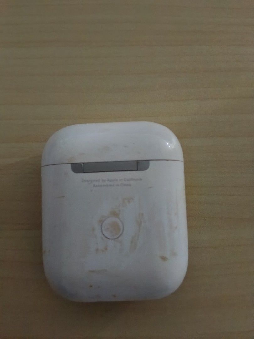 Apple AirPods with charging case (Category: Earphones) located in Caloocan City. Submitted by tongskie93 (Listing ID 1470478268, Image 3). Description: - Apple AirPods with charging case - Fully functional: great for music and calls - Case has visible dirt marks and scuffs from daily use - Battery status light glows green when opened - Both earbuds fit securely inside the case - Pairing button on the back works perfectly.