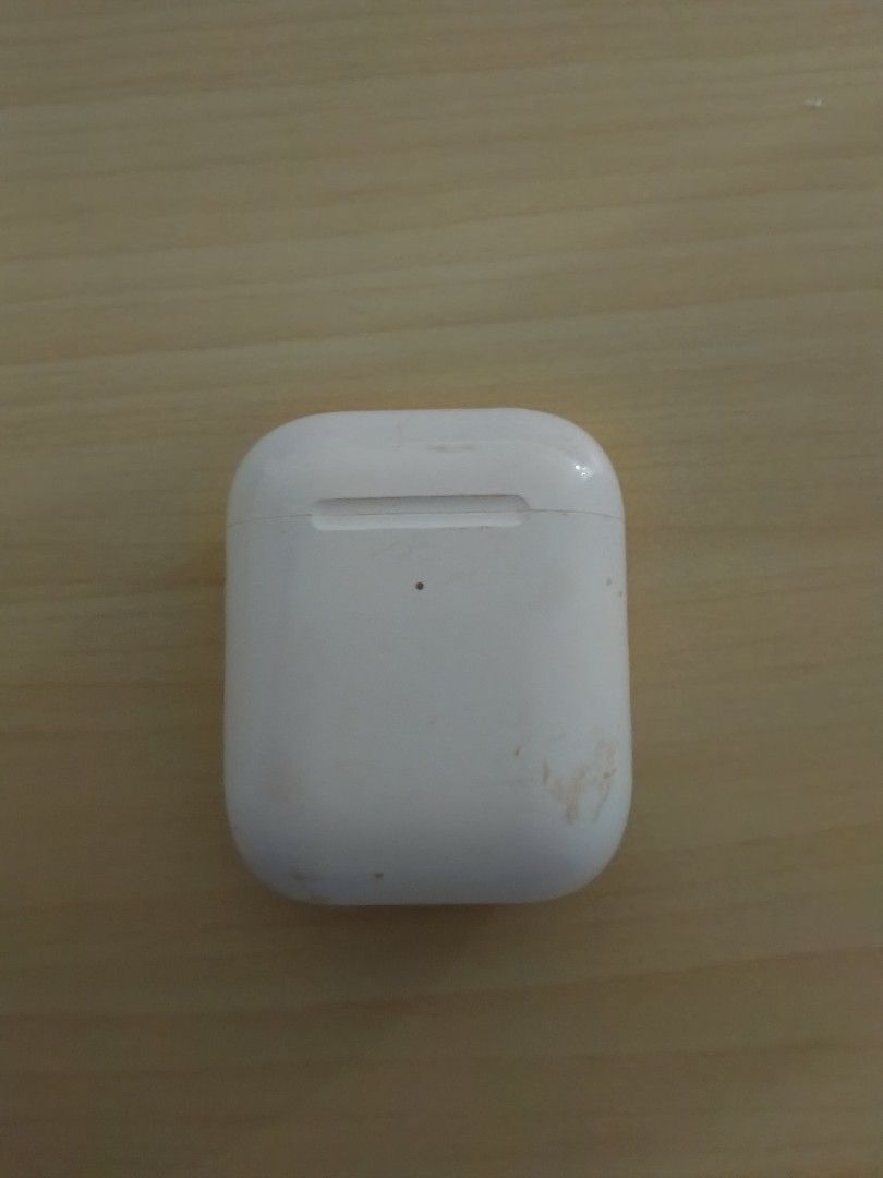 Apple AirPods with charging case (Category: Earphones) located in Caloocan City. Submitted by tongskie93 (Listing ID 1470478268, Image 2). Description: - Apple AirPods with charging case - Fully functional: great for music and calls - Case has visible dirt marks and scuffs from daily use - Battery status light glows green when opened - Both earbuds fit securely inside the case - Pairing button on the back works perfectly.
